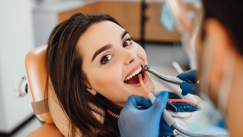 Smiling patient in the dental chair during treatment